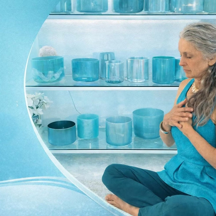 Wah! seated beside a collection of crystal singing bowls